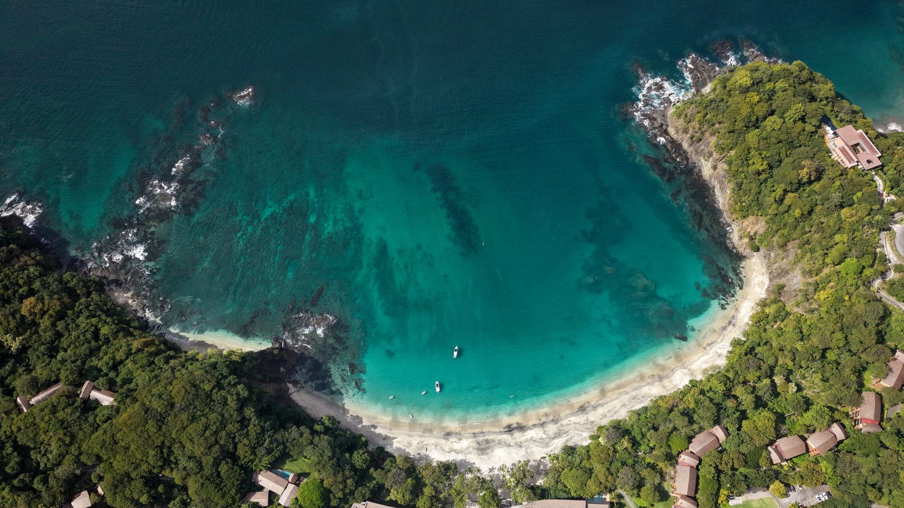 Aerial view of a turquoise bay on the Guanacaste coast of Costa Rica